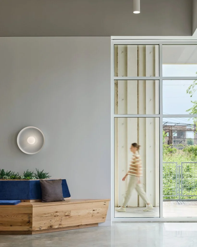 Modern interior with person walking by