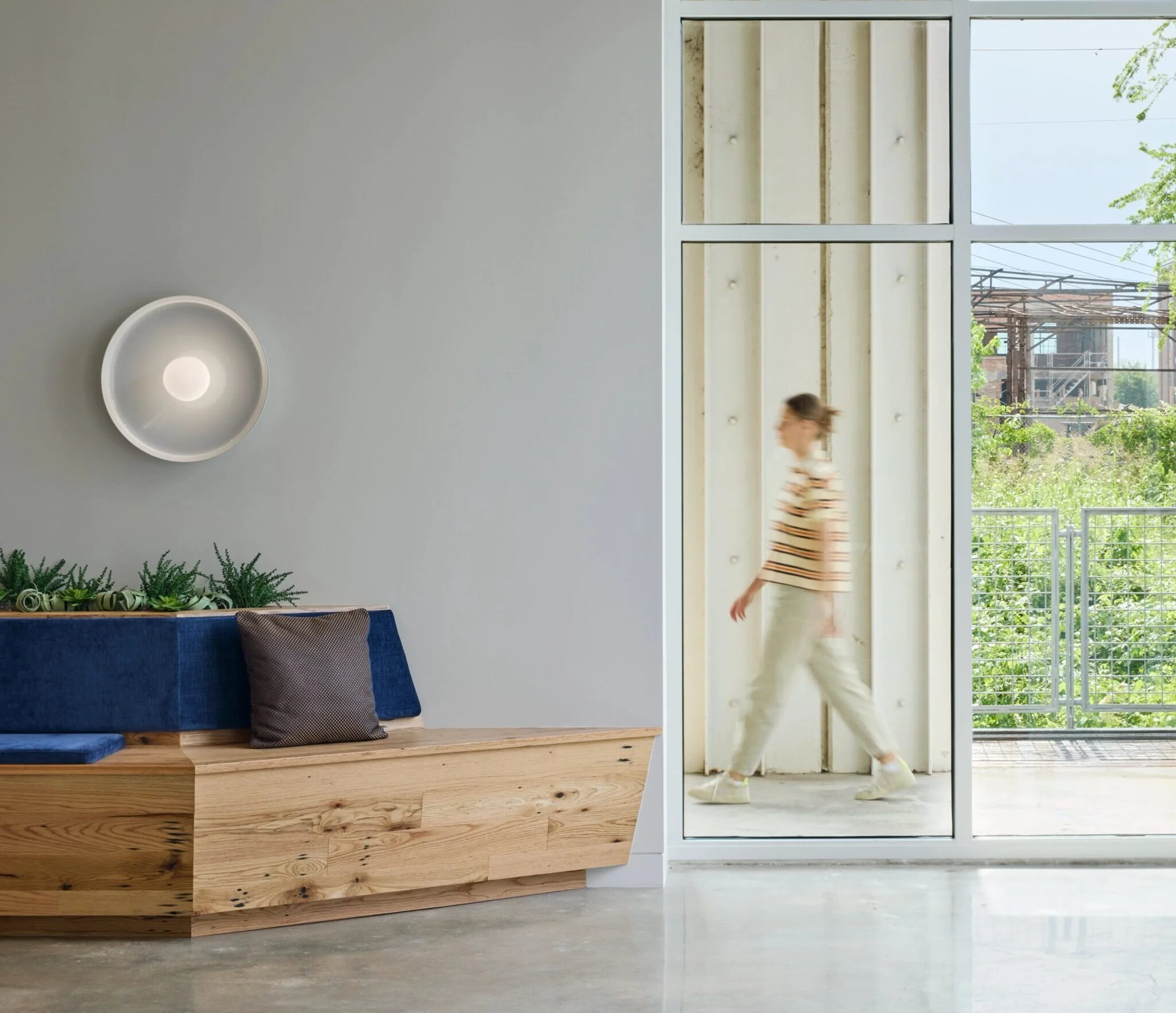 Modern interior with person walking by